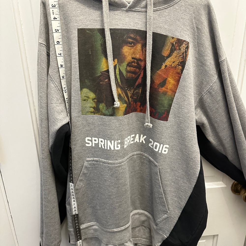 Gray Jimmy Hendrix Hoodie with Spring Break 2016 text. T-shirt hem  black side
